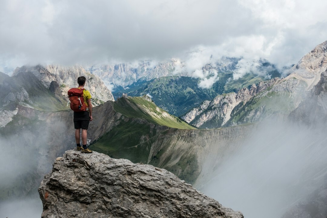 person climbing mountain