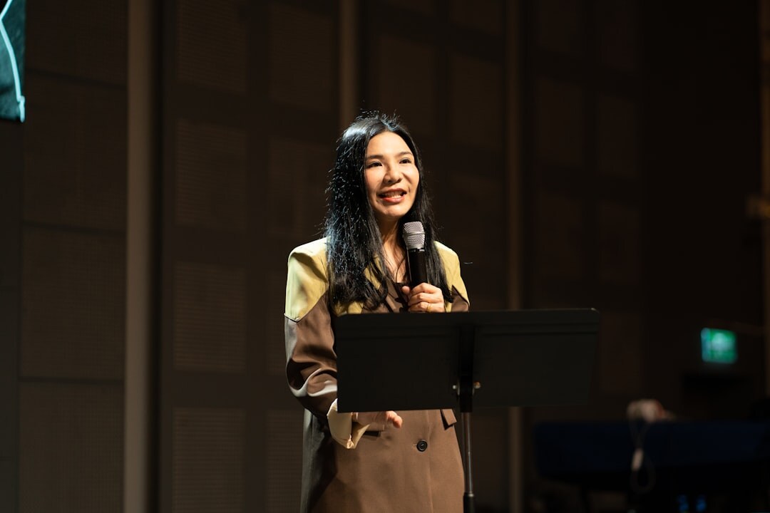confident speaker on stage