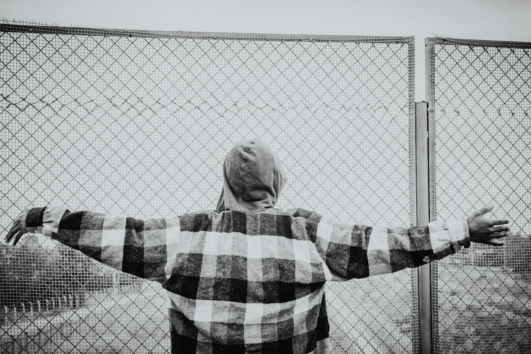 person breaking through barriers