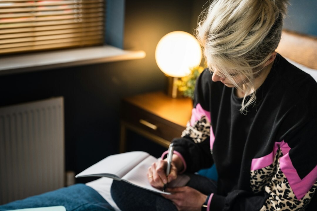 woman writing in journal