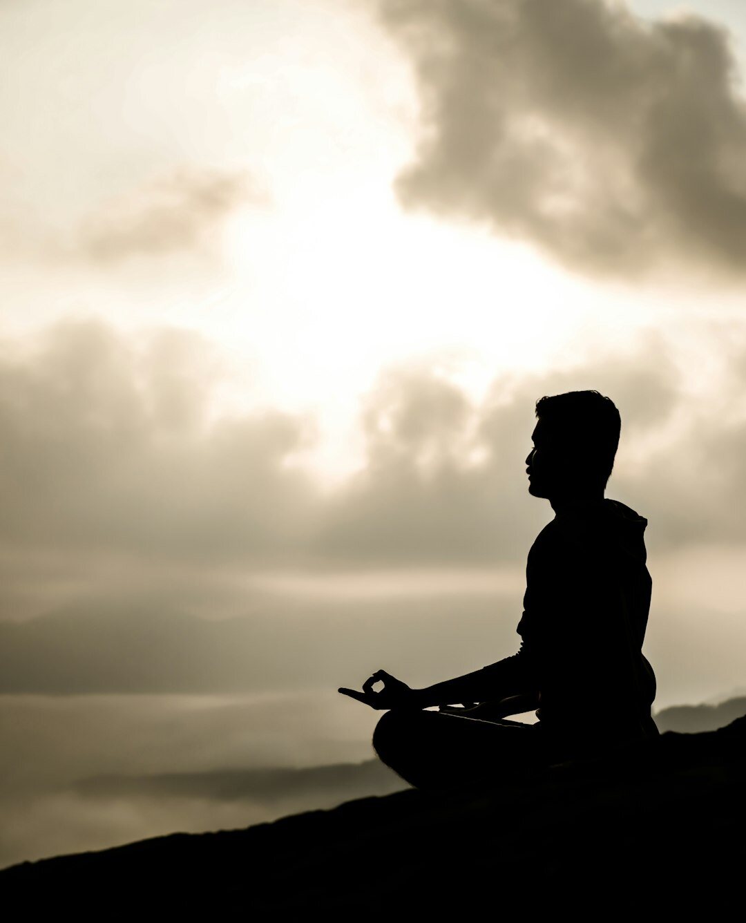 person meditating in nature